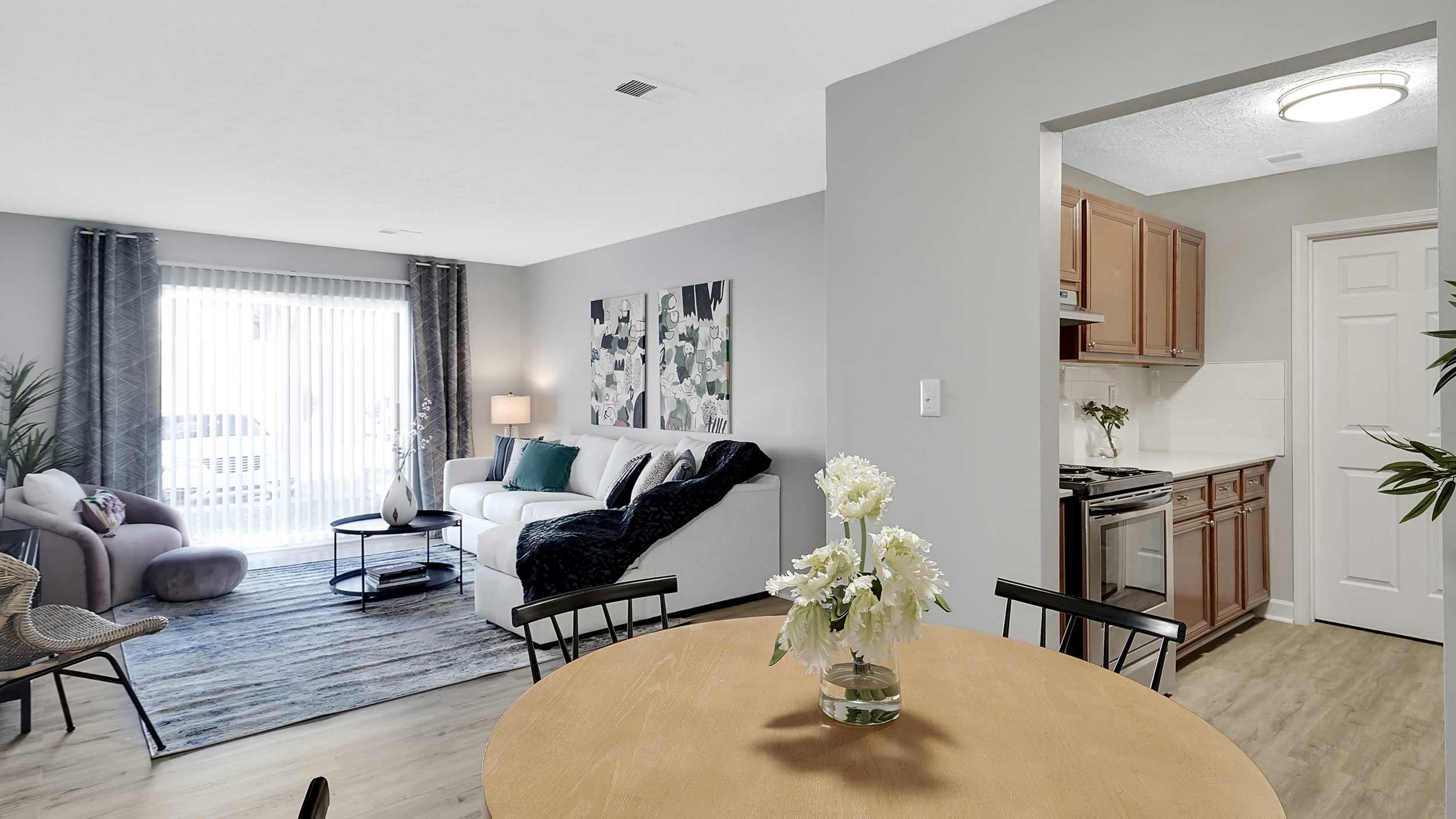 Open living room, dining, and kitchen